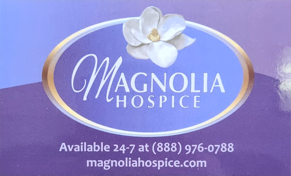 Purple Magnolia Hospice sign with logo and contact information.