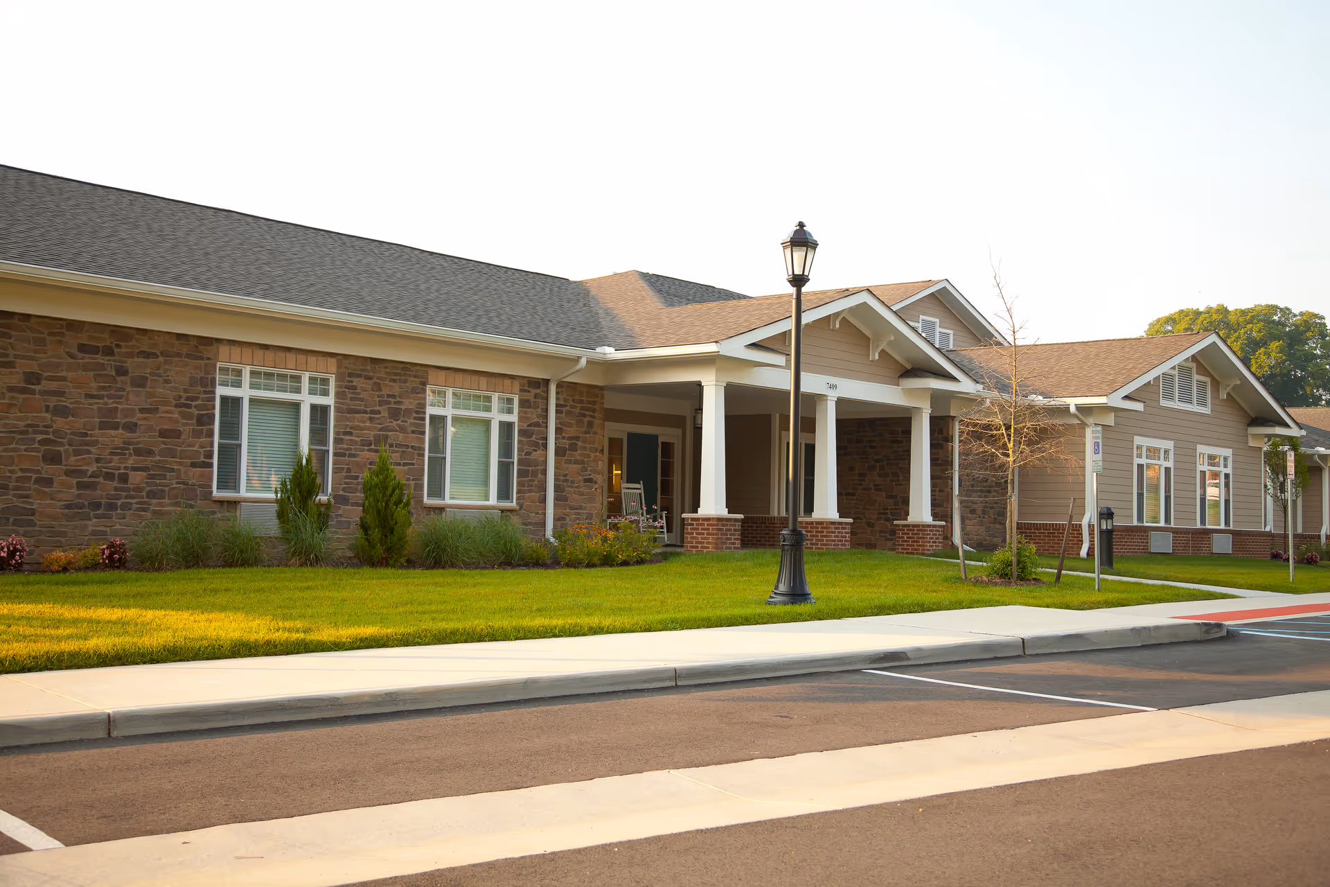 Exterior view of Sanders Assisted Living Residence with brick facade and entrance canopy