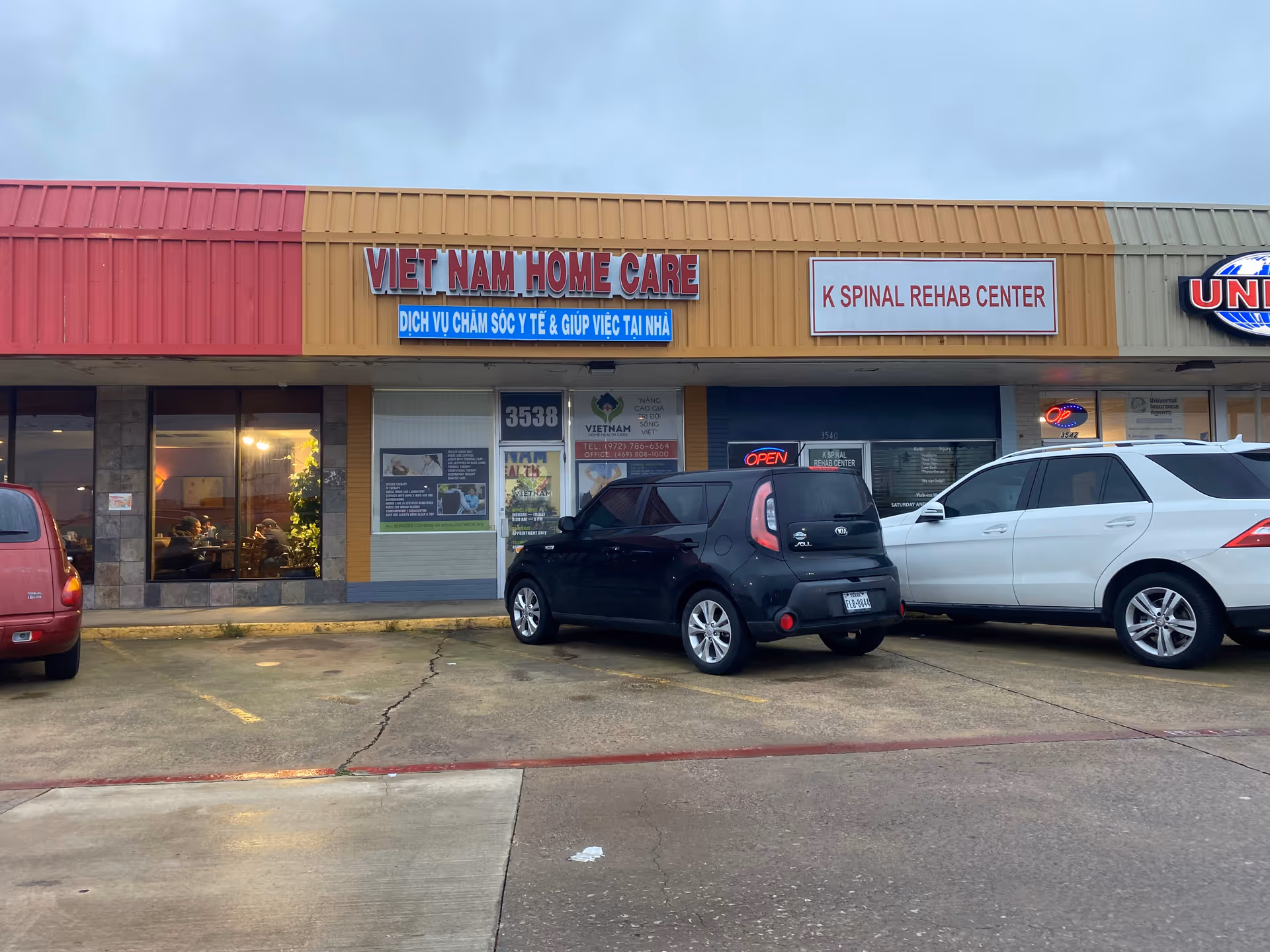 Exterior storefront shows Viet Nam Home Care and spinal rehab center signage, with parked cars.