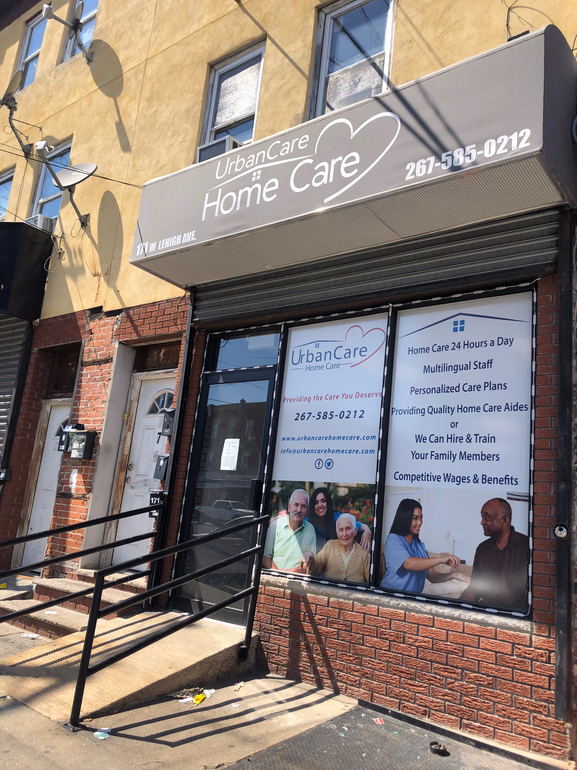Exterior storefront for UrbanCare Home Care with signage and posters in the front windows.