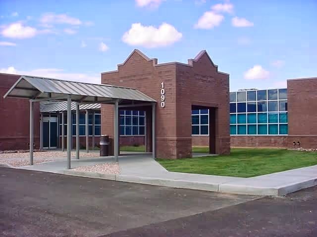 Exterior of Yavapai County Community Health Services building with a covered entrance and lawn.