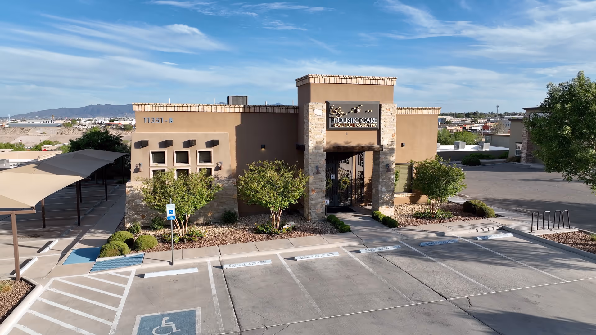 Exterior view of Holistic Care Home Health Agency building with entrance and parking.