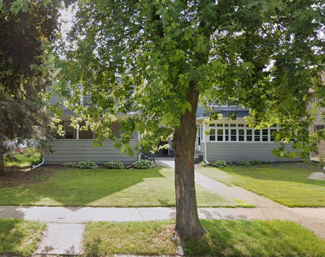 Exterior view of West Jefferson Health Care Center with a tree, sidewalk, and entrance.