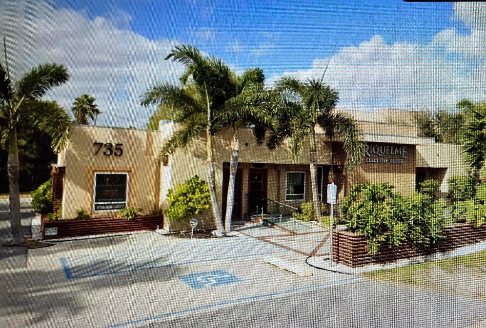 Front exterior of Cross My Heart Home Care with palm trees and parking.