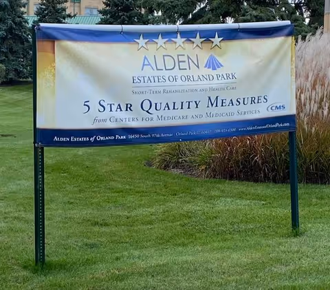 Outdoor sign advertising Alden Estates of Orland Park on a grassy lawn.