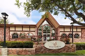 Front view of Victoria Care Center building with sign and landscaped entrance.