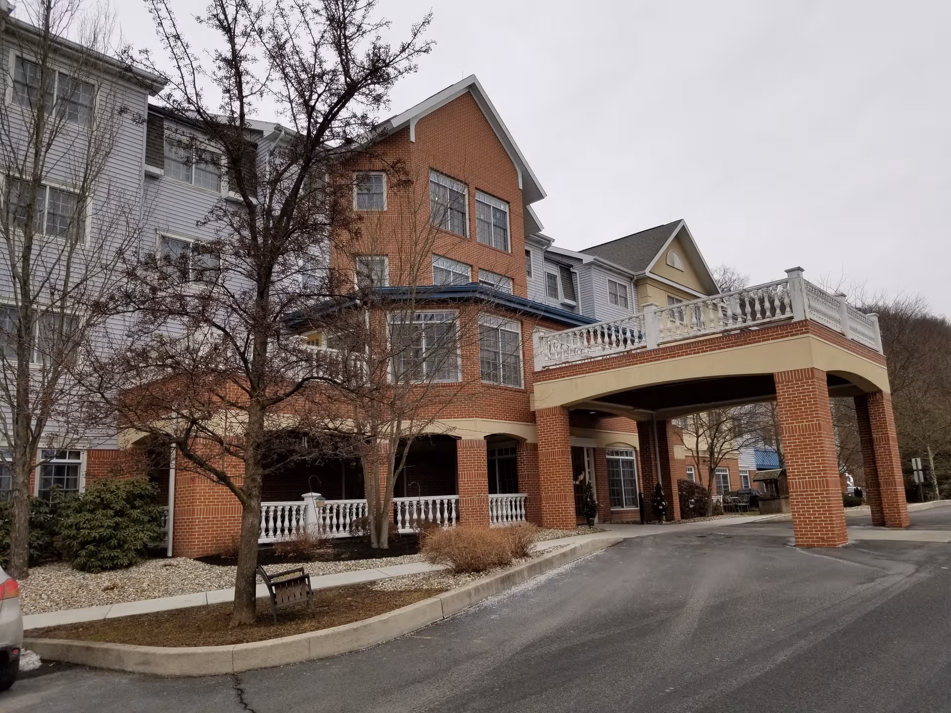 Exterior view of Luther Ridge at Seiders Hill VA East, showing brick building and porte-cochere entry.