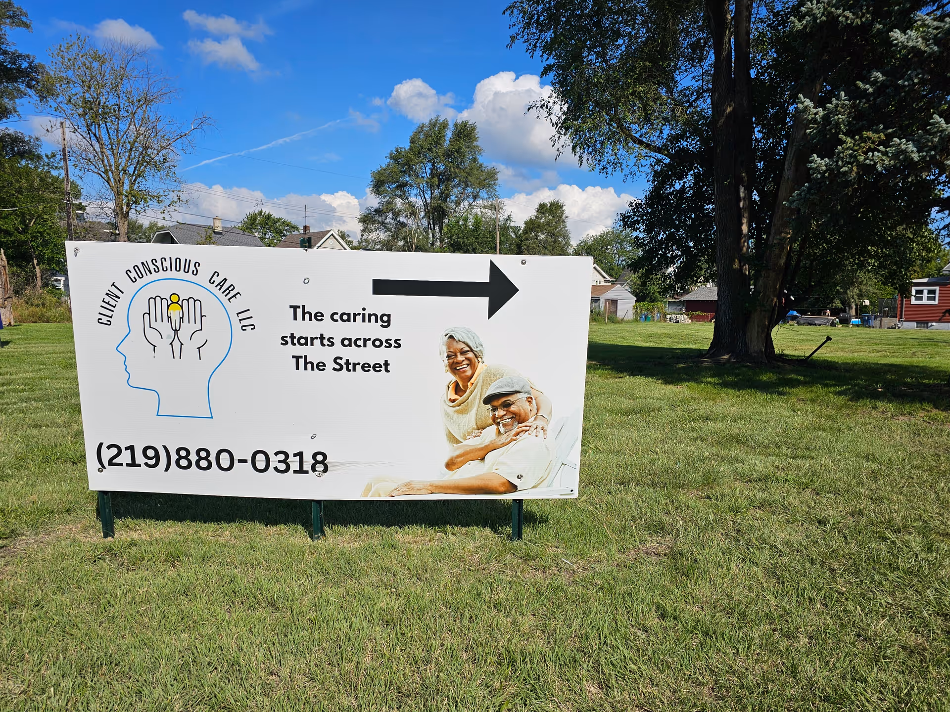 Large outdoor sign for Client Conscious Care LLC on a grassy field.