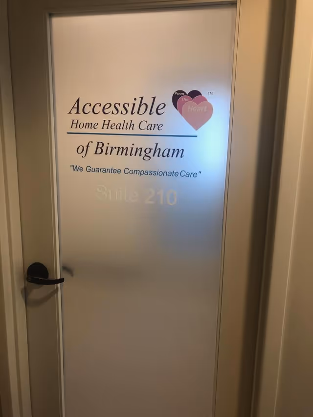 Frosted interior door displays Accessible Home Health Care of Birmingham and Suite 210.