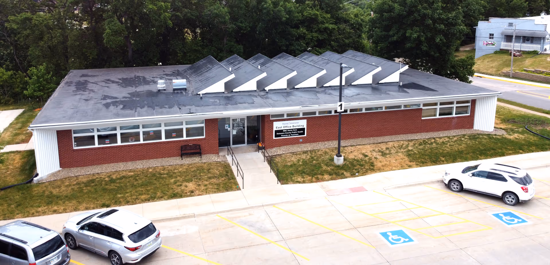 Exterior of Regional Medical Center Home Care, a single-story brick facility with a front parking lot.