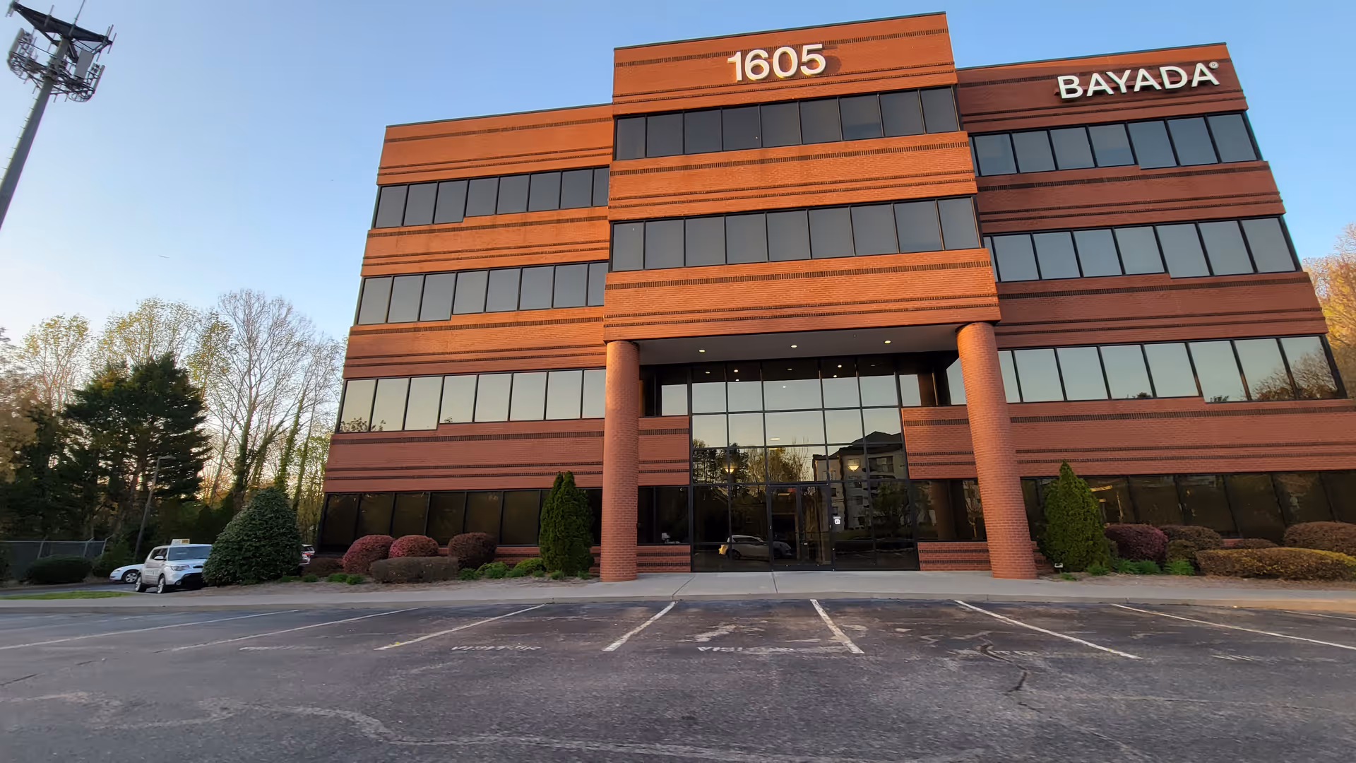 Bayada Adult Nursing exterior building with glass entrance and parking area.