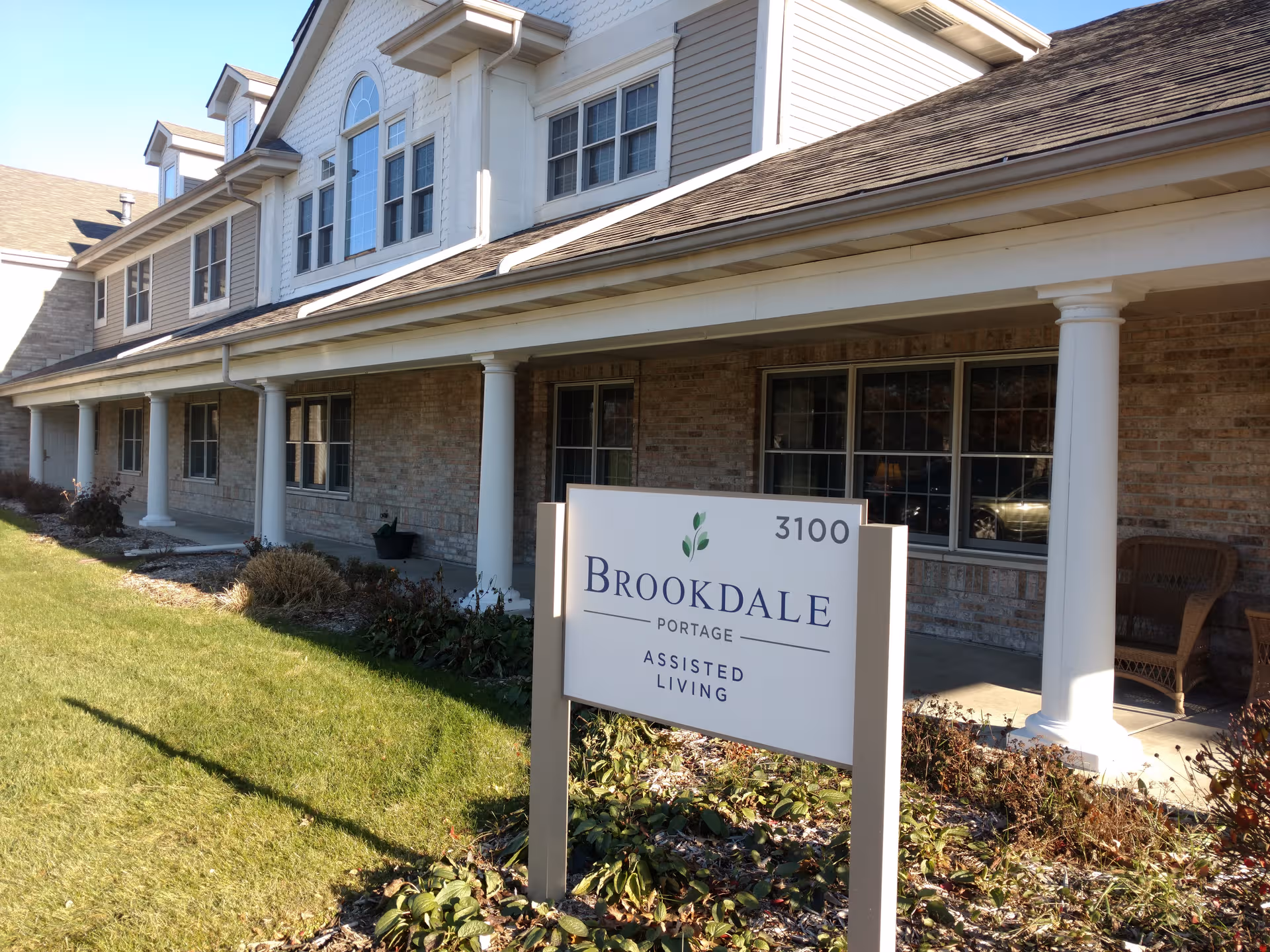 Exterior view of Brookdale Portage assisted living facility with a sign in front.