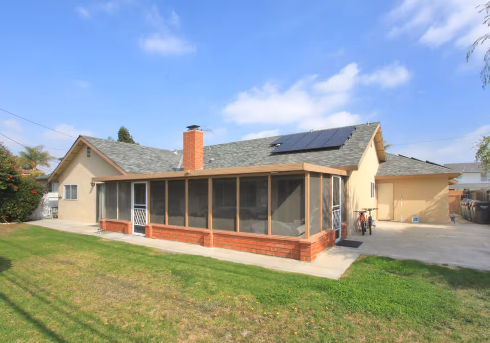 Miles Place of Fountain Valley, a single-story beige facility with screened porch and brick base.