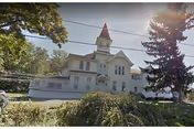 Exterior of Wellsboro Shared Homes, a white multi-story building with turret.