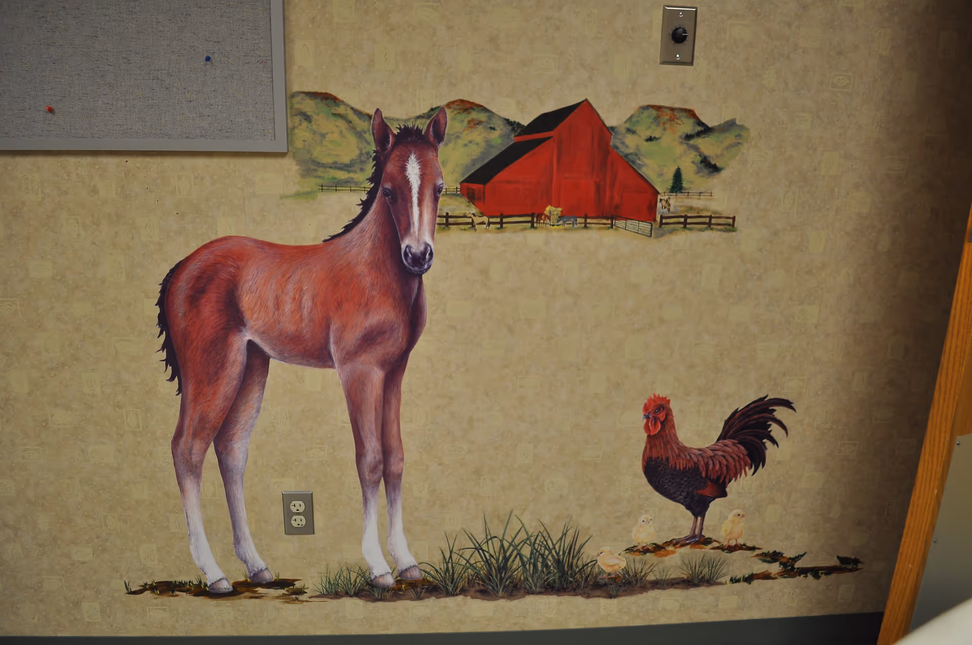 Painted farm mural on beige interior wall featuring a horse, rooster, and chicks.