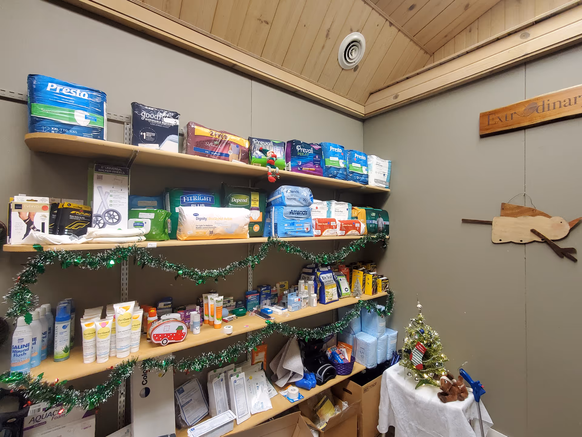 Shelves stocked with medical supplies and toiletries in a small supply room.