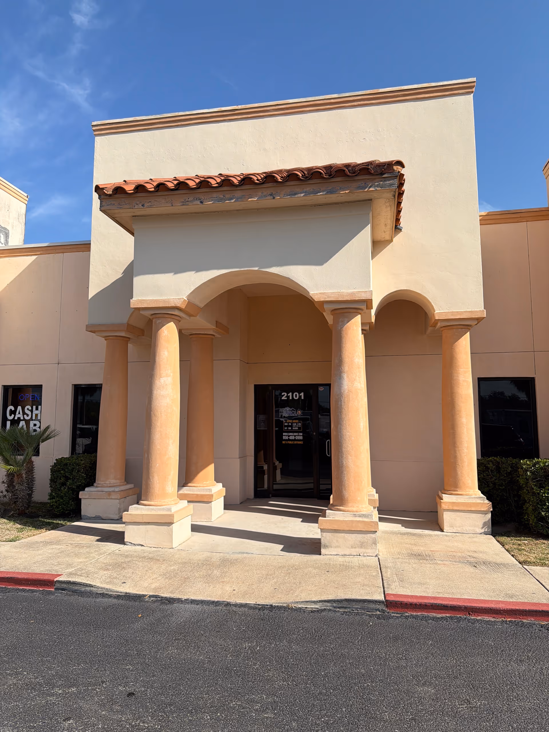 Sunglo Home Health Services facility entrance with arches and four columns, beige exterior.