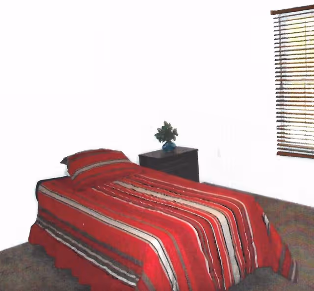 A single bed with red striped bedding in a bright bedroom next to a nightstand with a plant and a window with blinds.