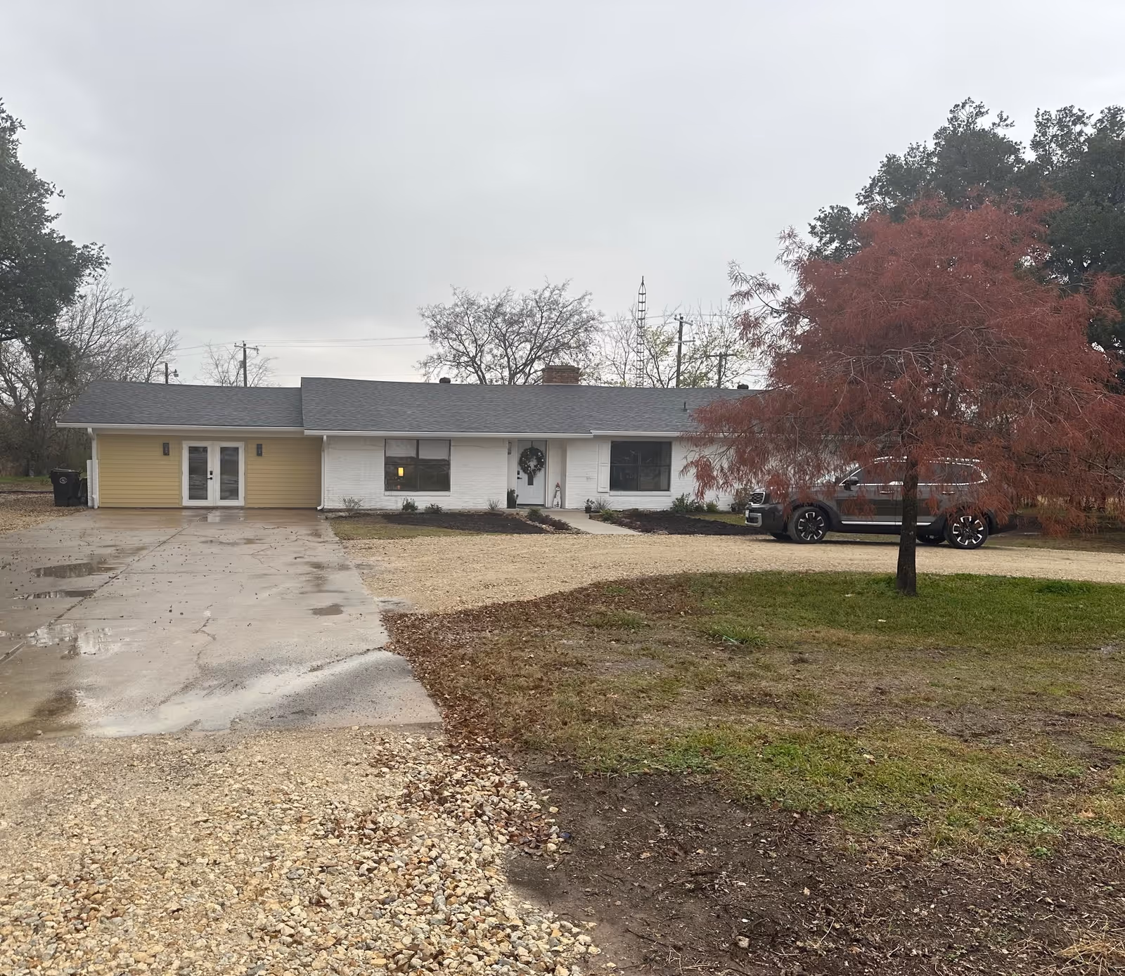 Front view of a single-story New Life Home Healthcare facility with driveway and parked SUV.