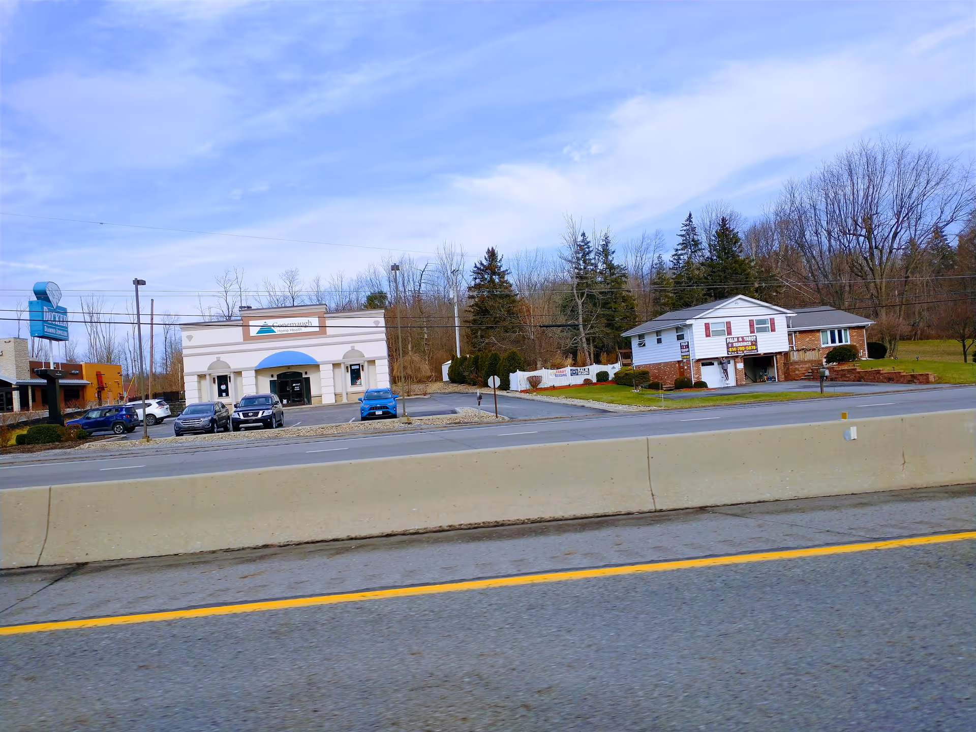 Street view of a small commercial strip, including Conemaugh Home Health offices.