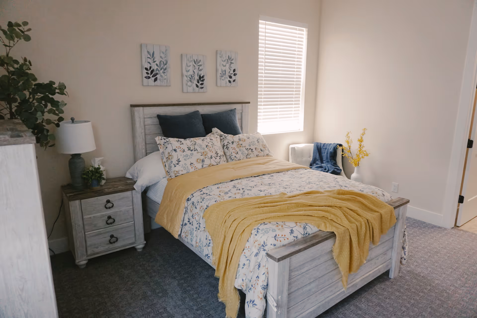 A cozy, well-lit bedroom with a rustic wooden bed and matching furniture.
