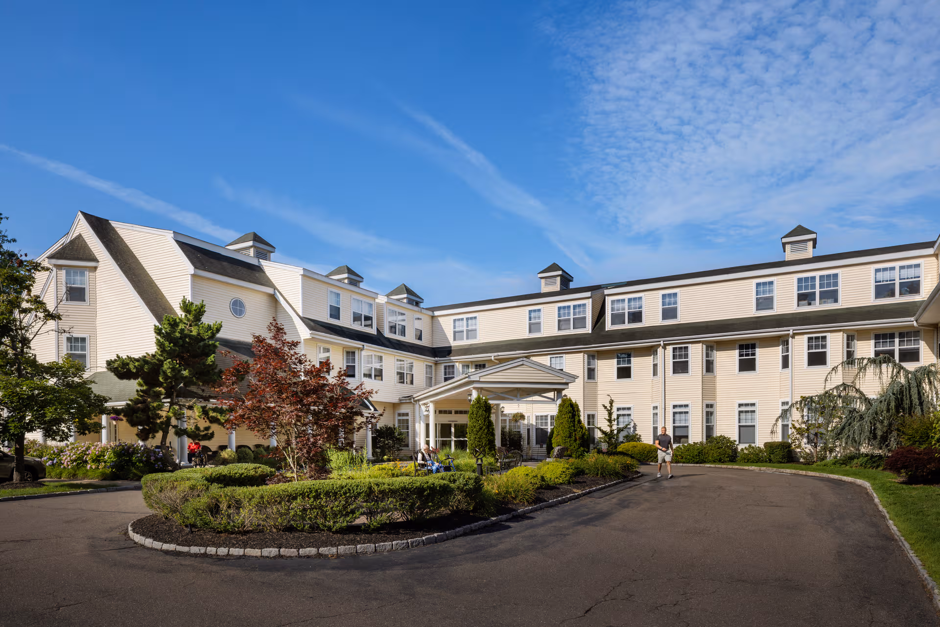 Exterior of HarborChase of Branford with circular driveway and landscaping.