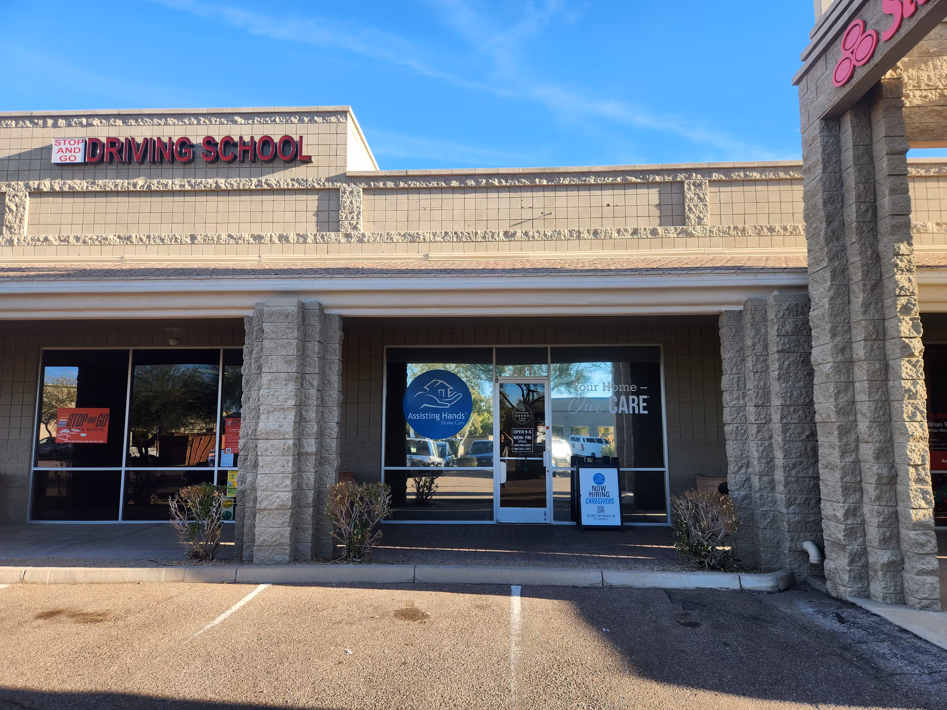 Facade of Assisting Hands Home Care storefront in a strip mall exterior.