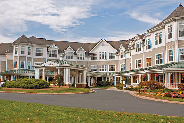 Exterior view of Brookdale West Hartford, a multi-story senior living building with a covered entrance.