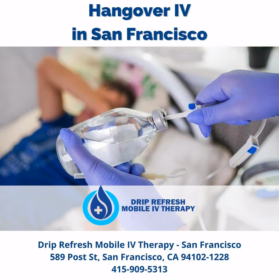 Gloved hands prepare an IV bag for a patient in a medical bed.