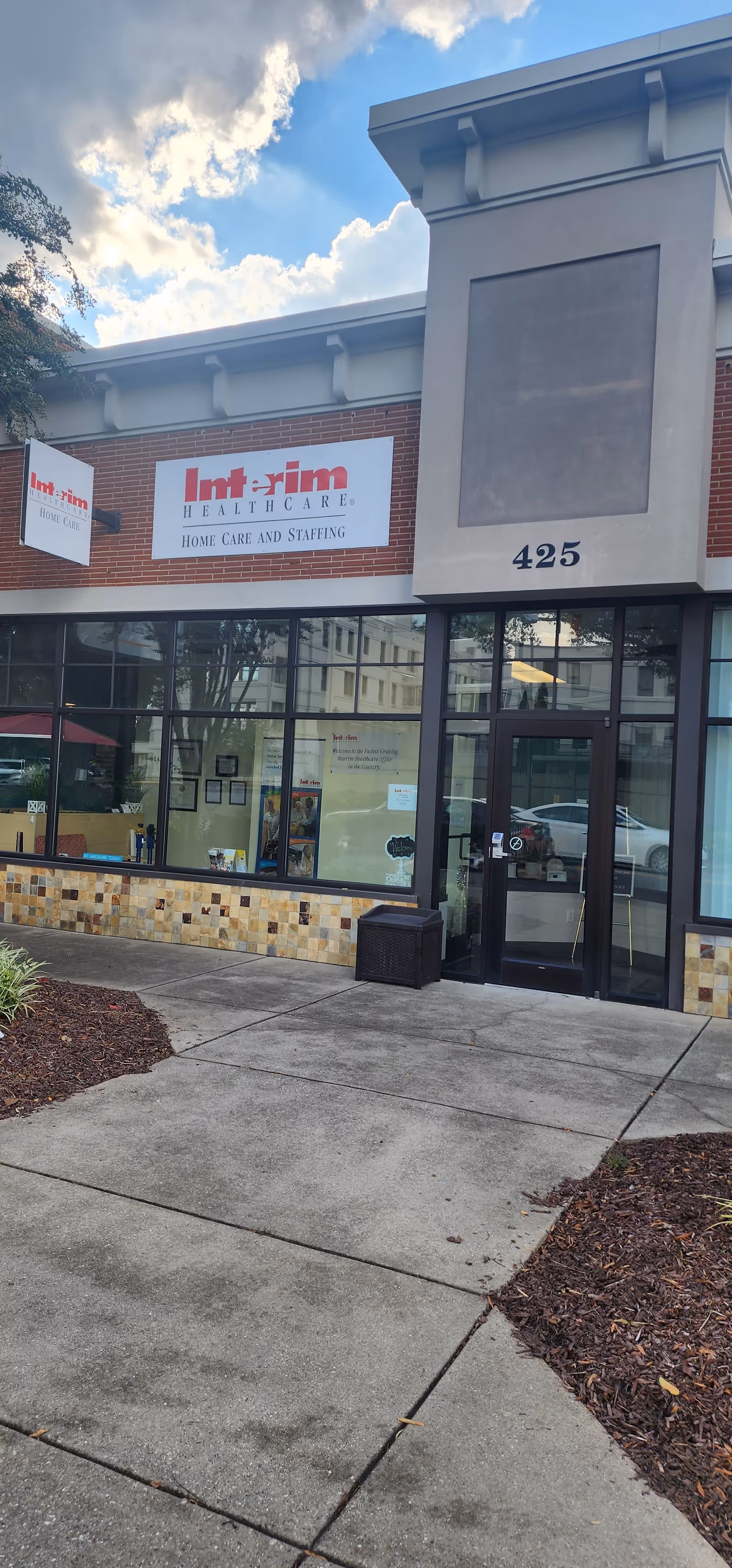 Exterior view of Interim HealthCare of Mooresville building entrance with glass doors