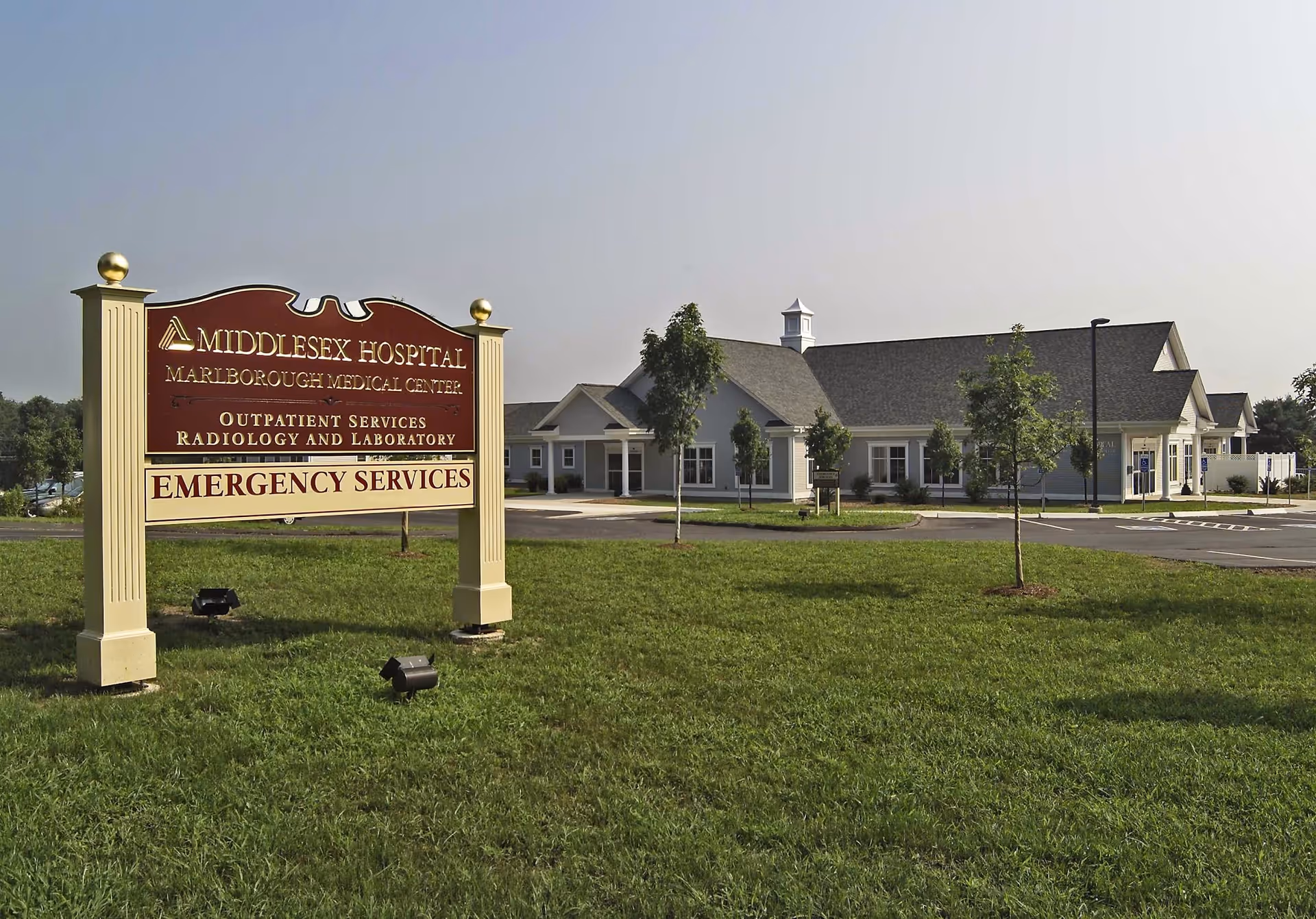 Exterior view of Middlesex Health Marlborough Medical Center with a front sign.