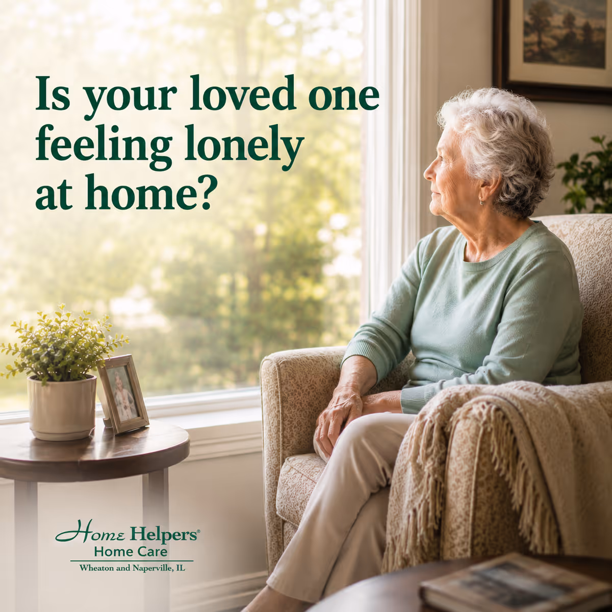 Elderly woman seated in a sunlit living room beside a side table with a plant.