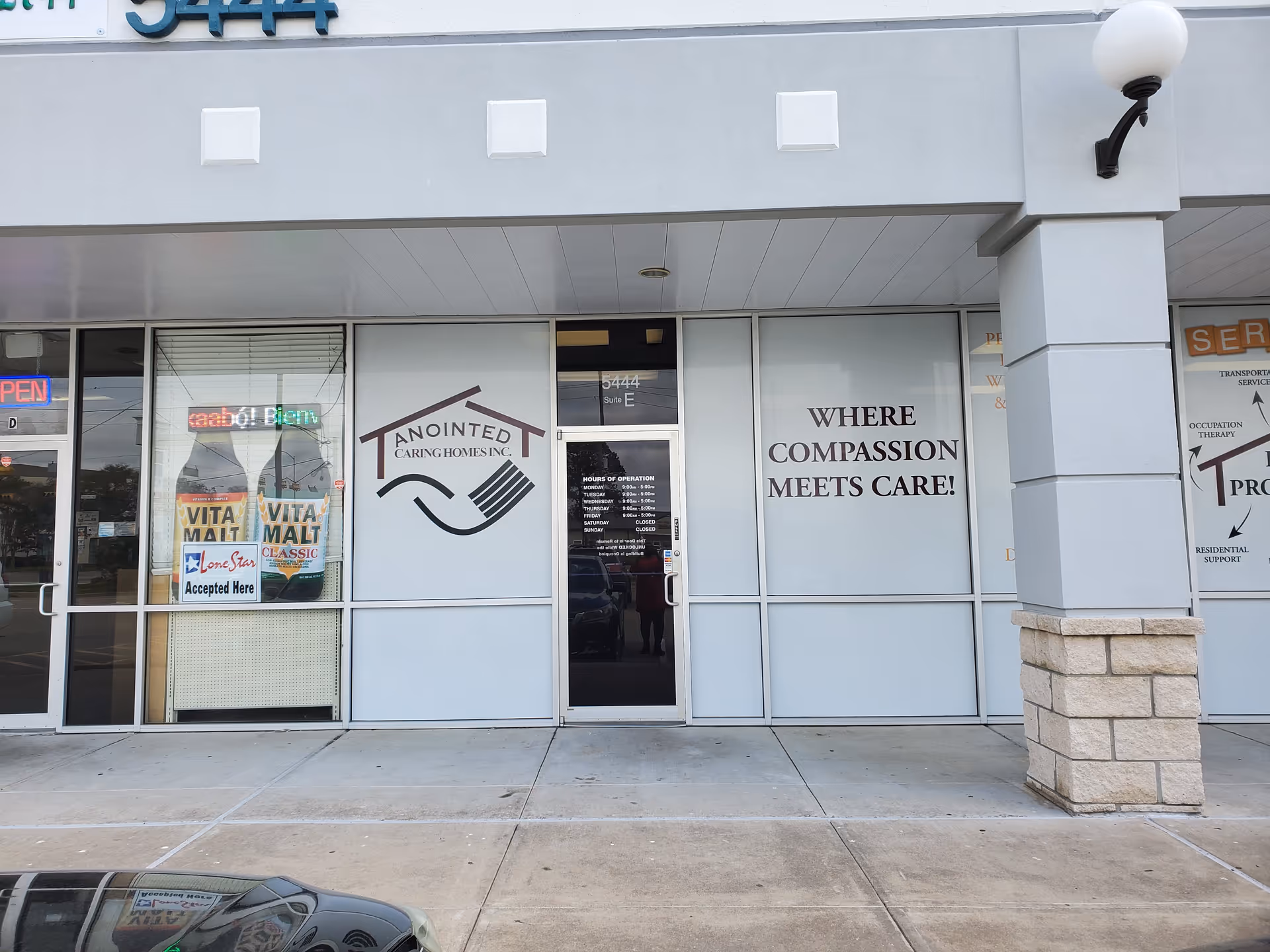 Exterior storefront of Anointed Caring Homes with large signage and glass entrance.