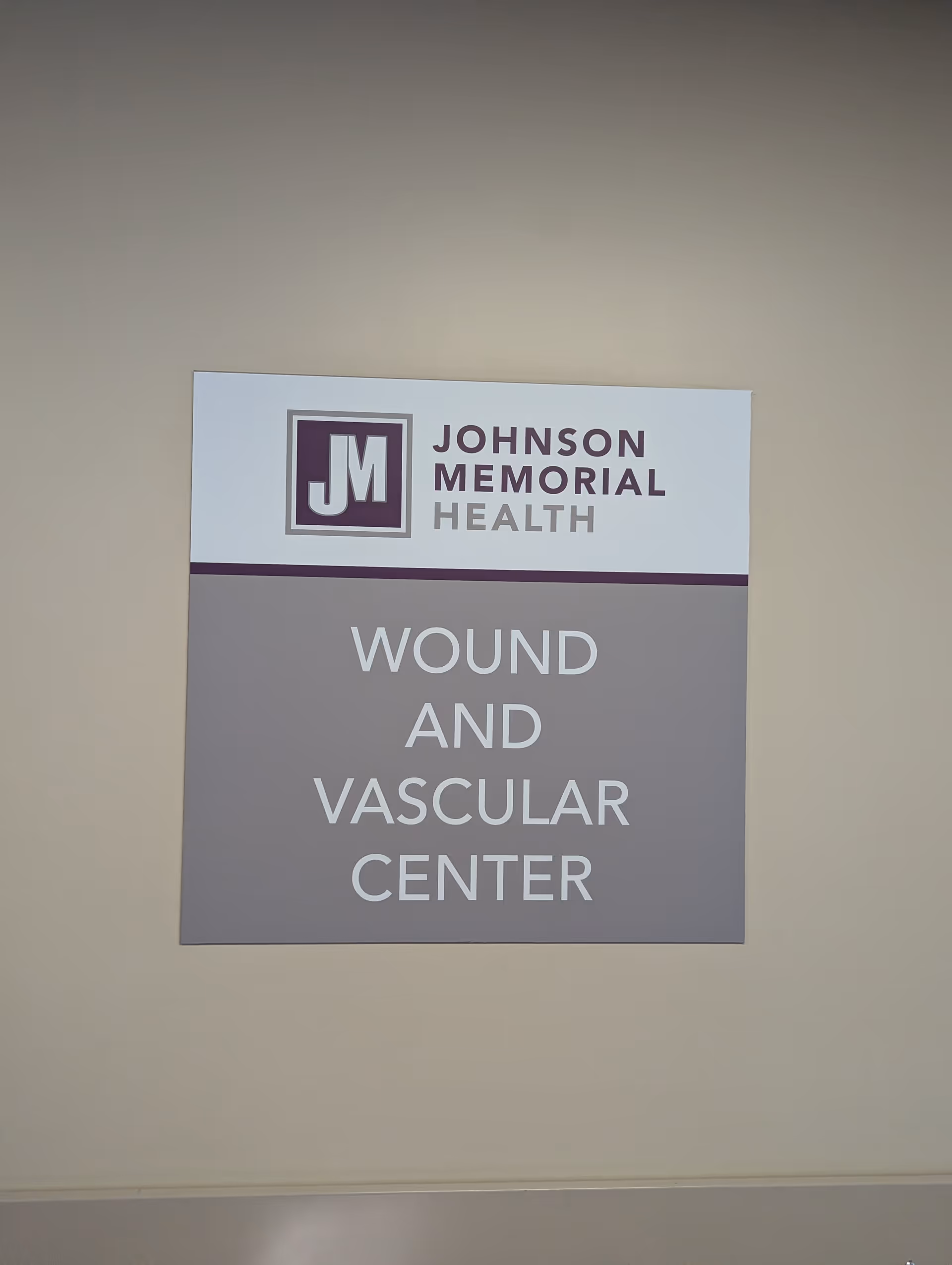 Hospital interior wall with Johnson Memorial Health sign reading Wound and Vascular Center.