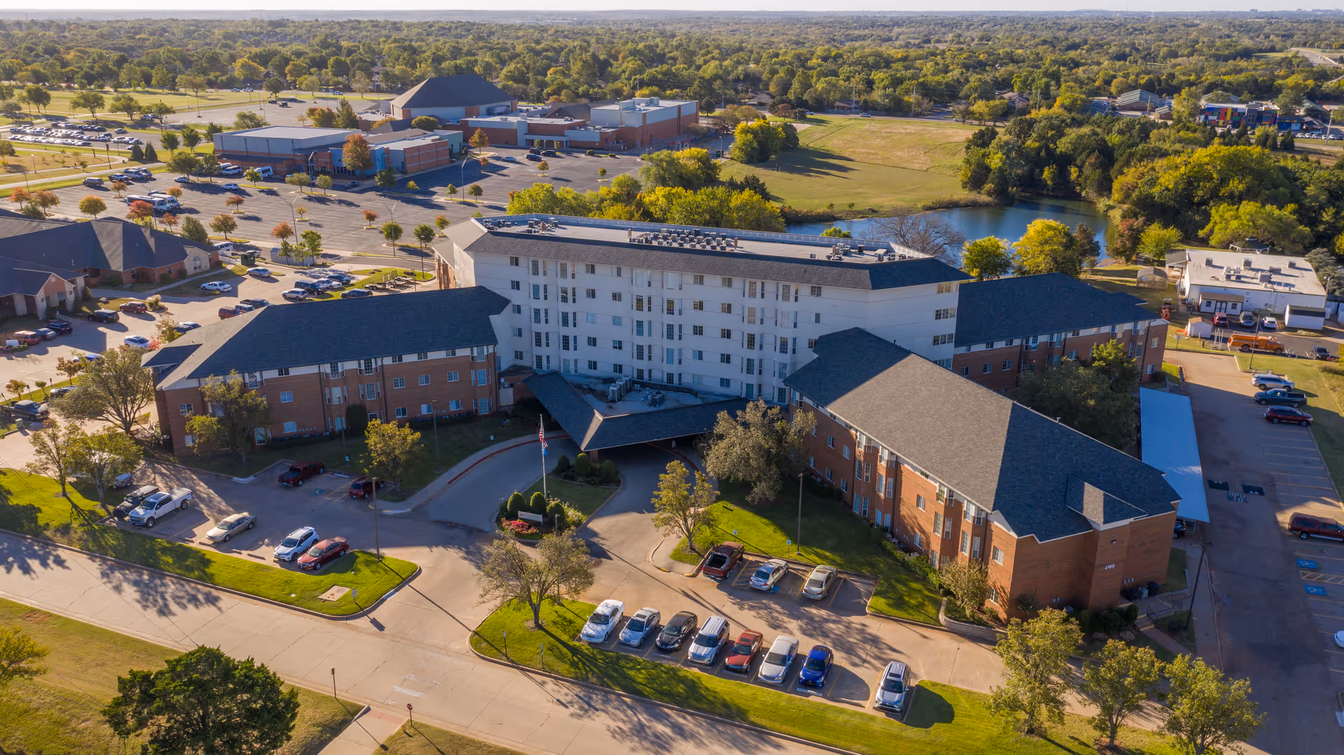 Aerial view of Tealridge Independent Living campus with brick buildings and landscaped grounds.