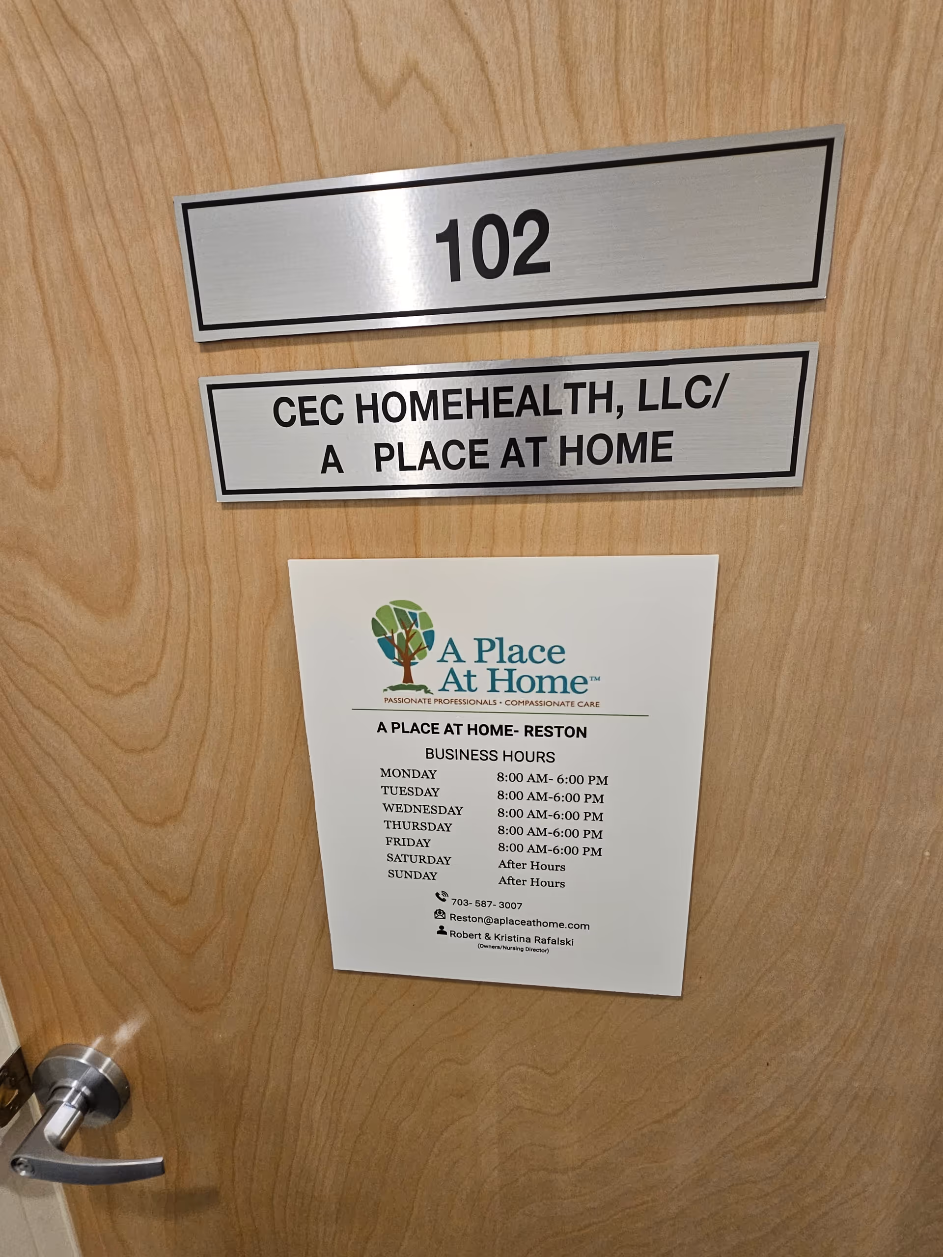 Wood door shows room number 102 and A Place At Home signage.