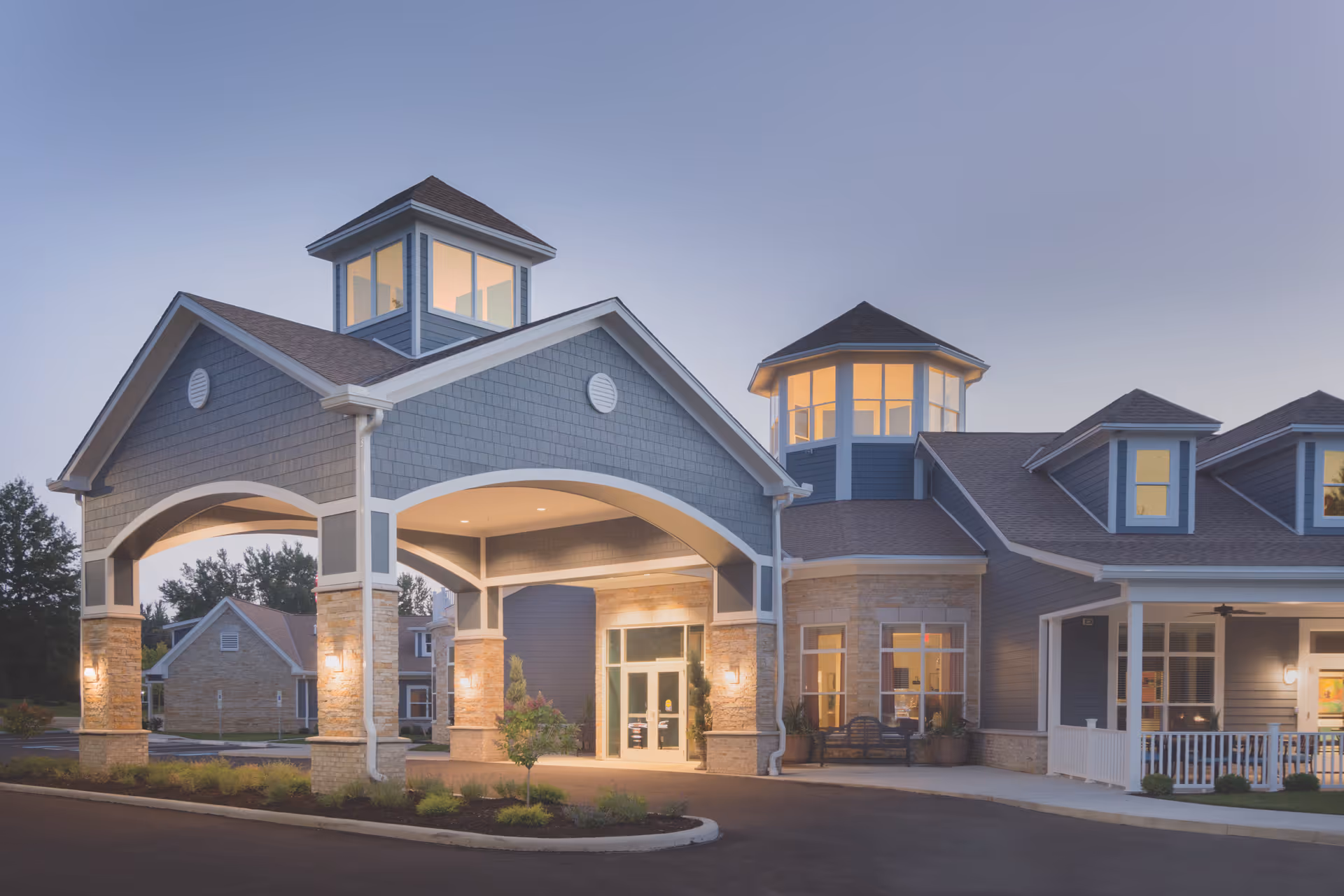 Exterior view of Landerbrook Transitional Care building entrance with arches.