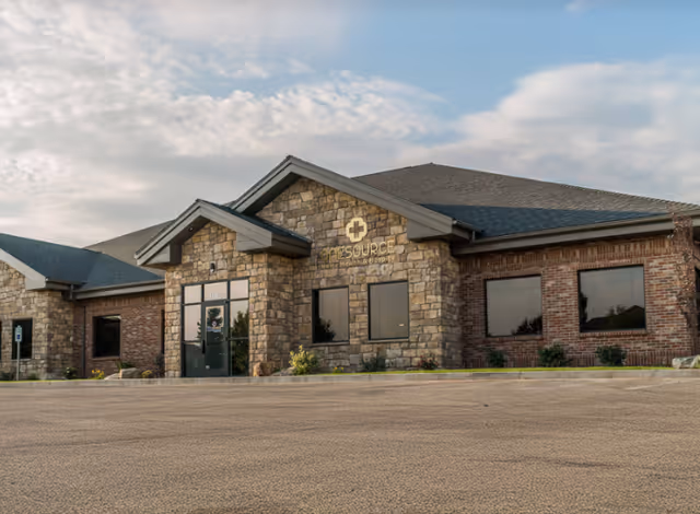 Exterior view of OneSource Home Health & Hospice Pocatello building with stone facade