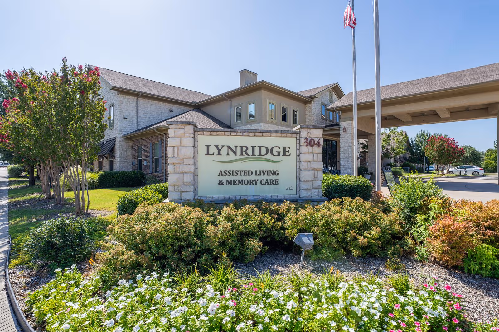 Lynridge Assisted Living sign with landscaped front entrance.