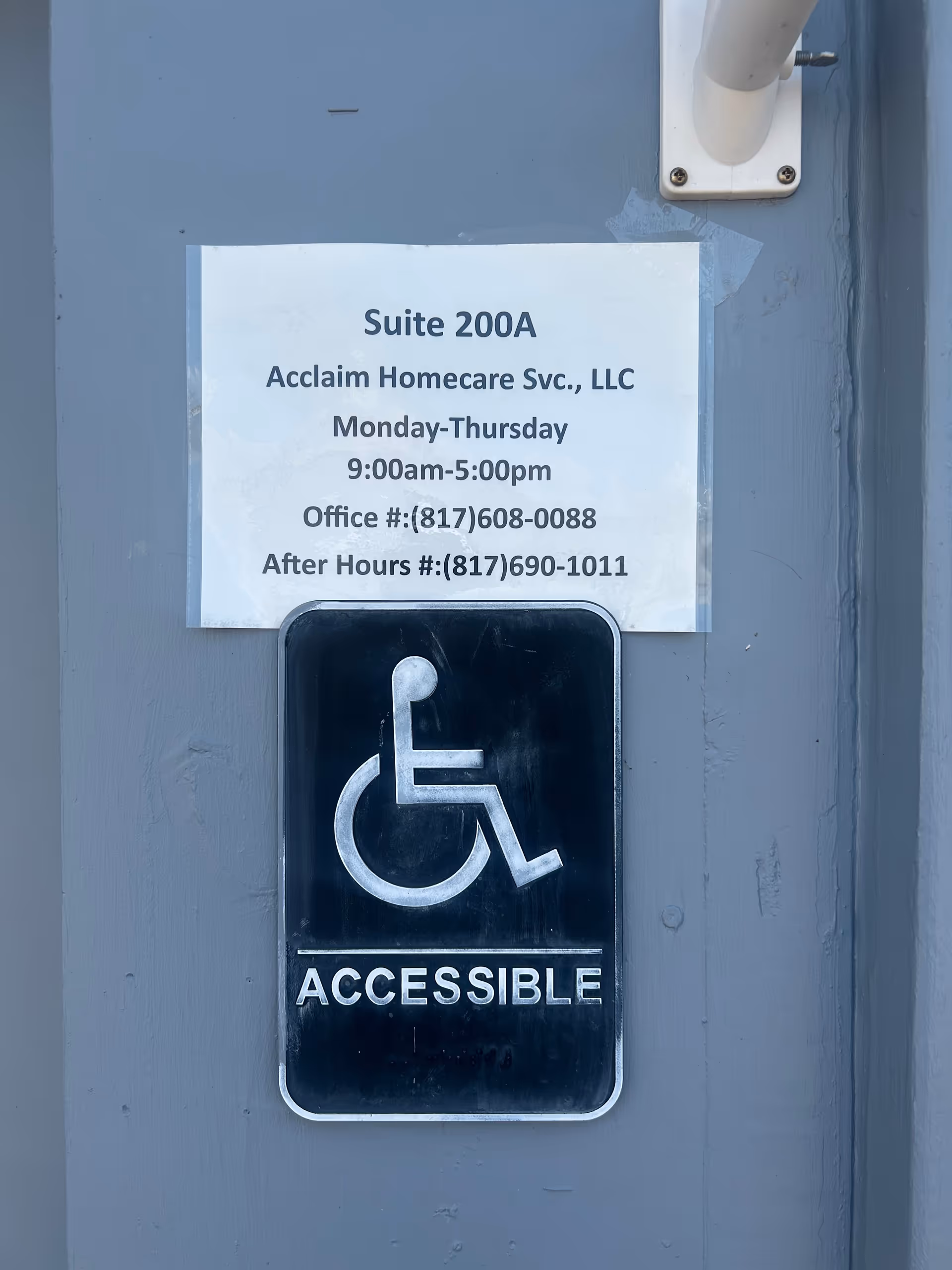Exterior wall with suite sign and handicap accessible placard for Acclaim Homecare Svc., LLC.
