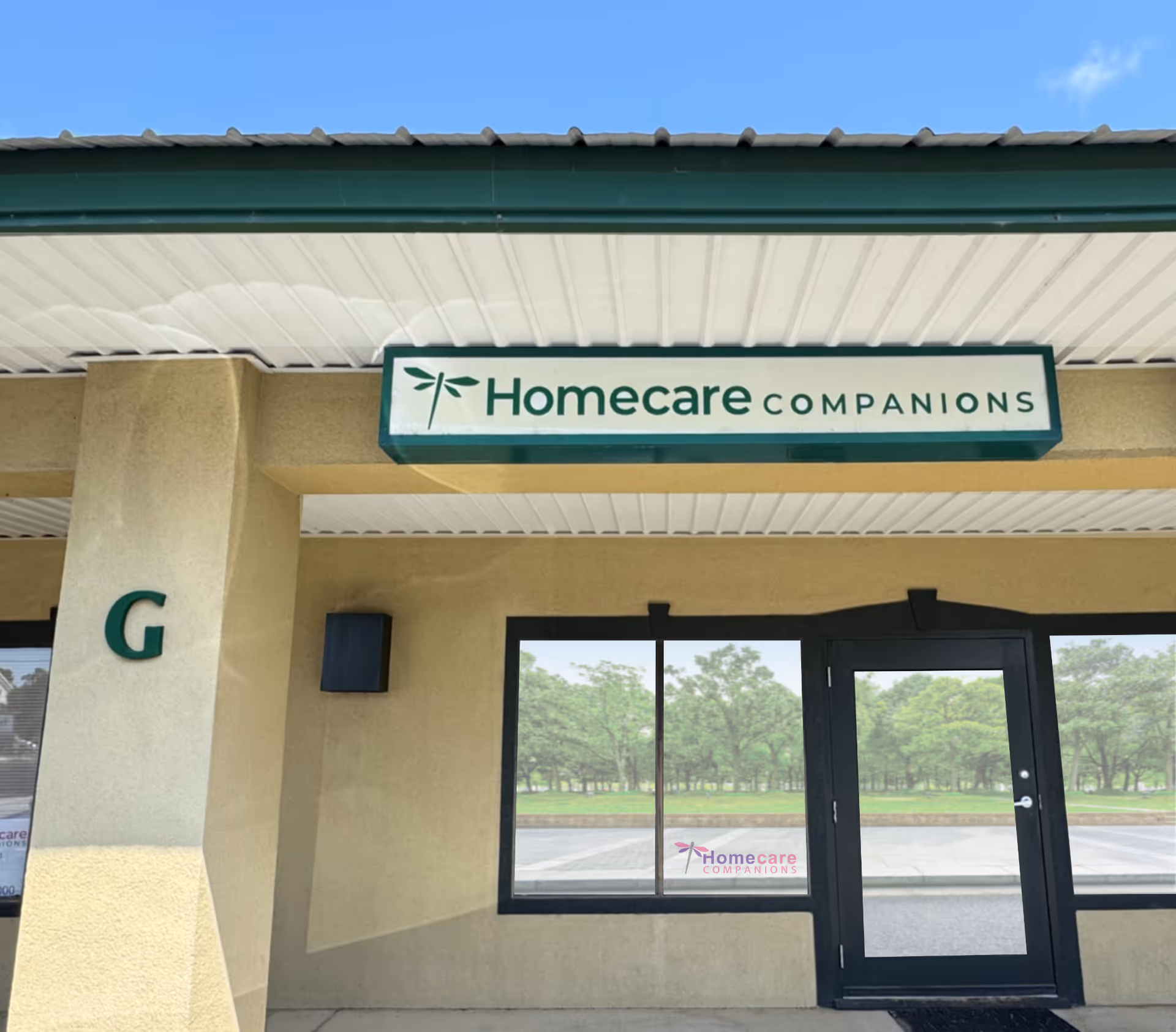 Exterior of the Homecare Companions facility entrance with its green sign.