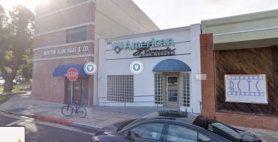 Street view of a storefront with American Home Health signage and entrance.