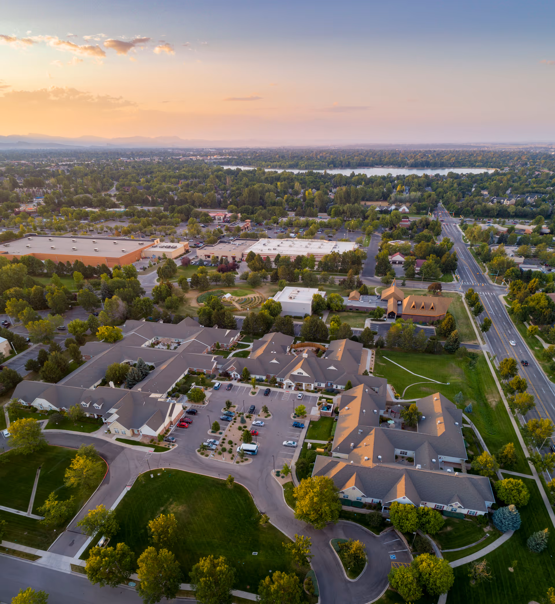 Aerial view of Brookdale Fort Collins Assisted Living campus with multiple buildings and green landscaping.