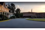 Front view of Cortlandt Healthcare exterior with a curved driveway and trees.