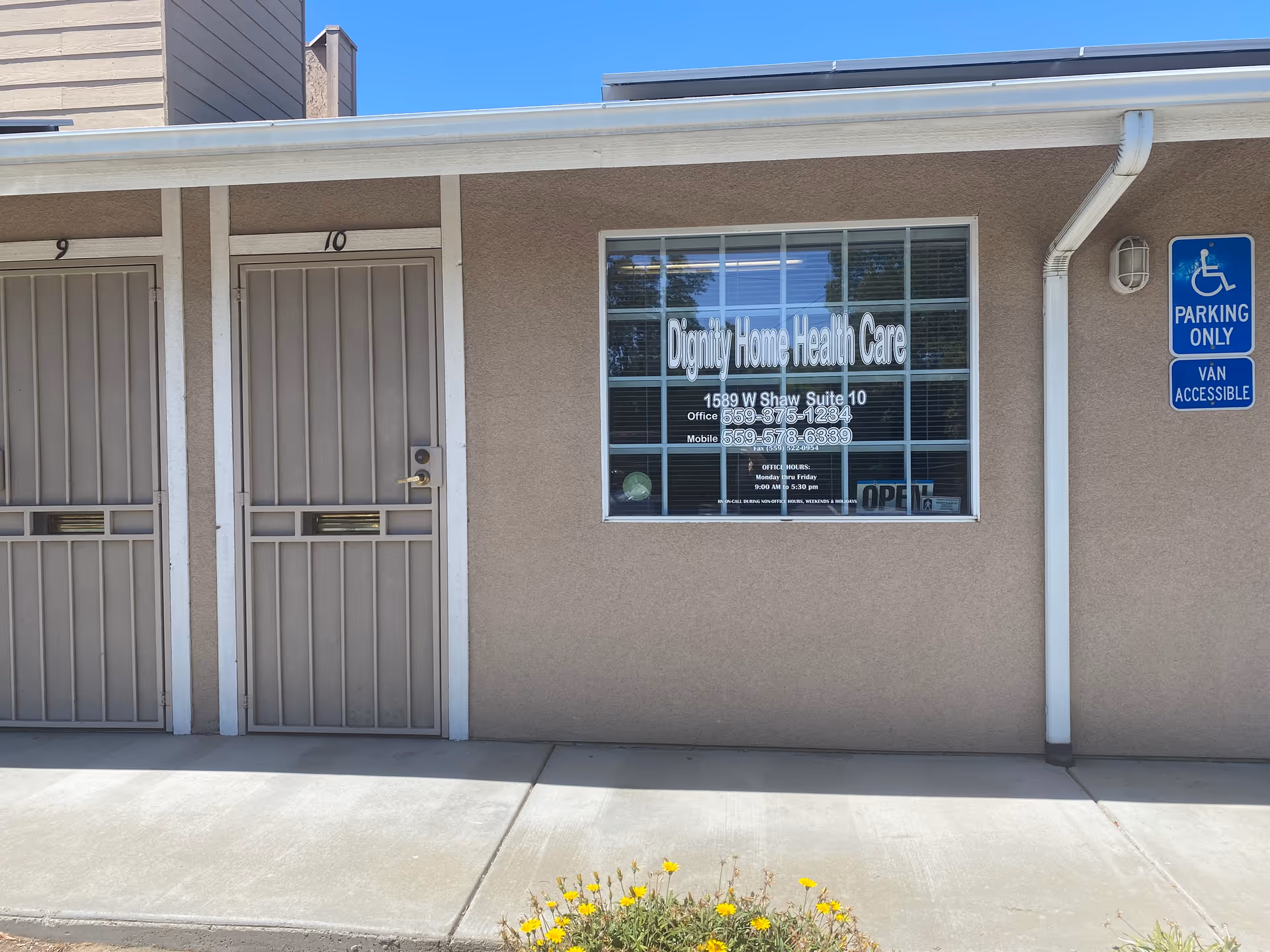 Exterior view of Dignity Home Health Care with numbered doors and a storefront window sign.