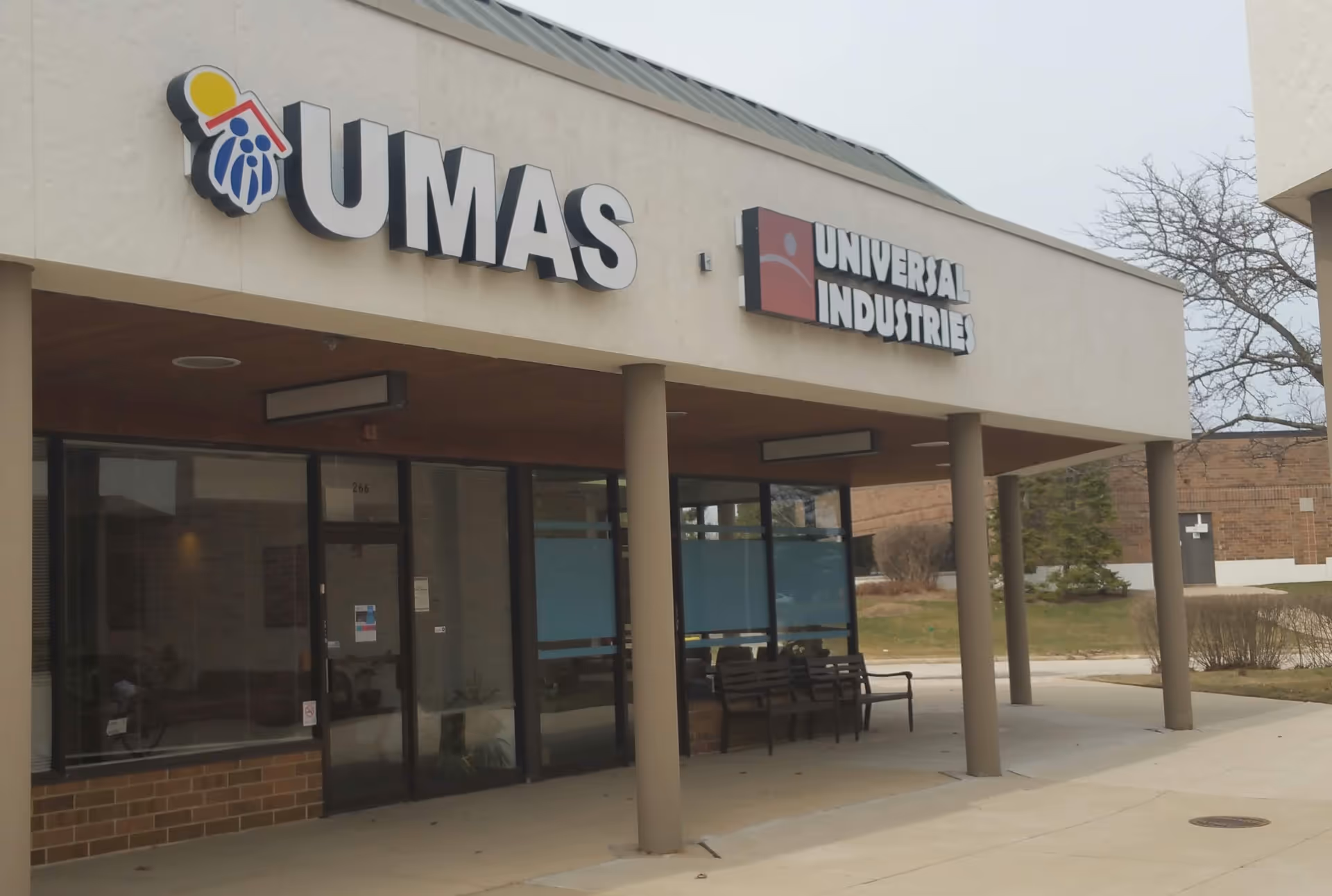 Exterior view of a storefront with UMAS sign for Universal Metro Aging Services