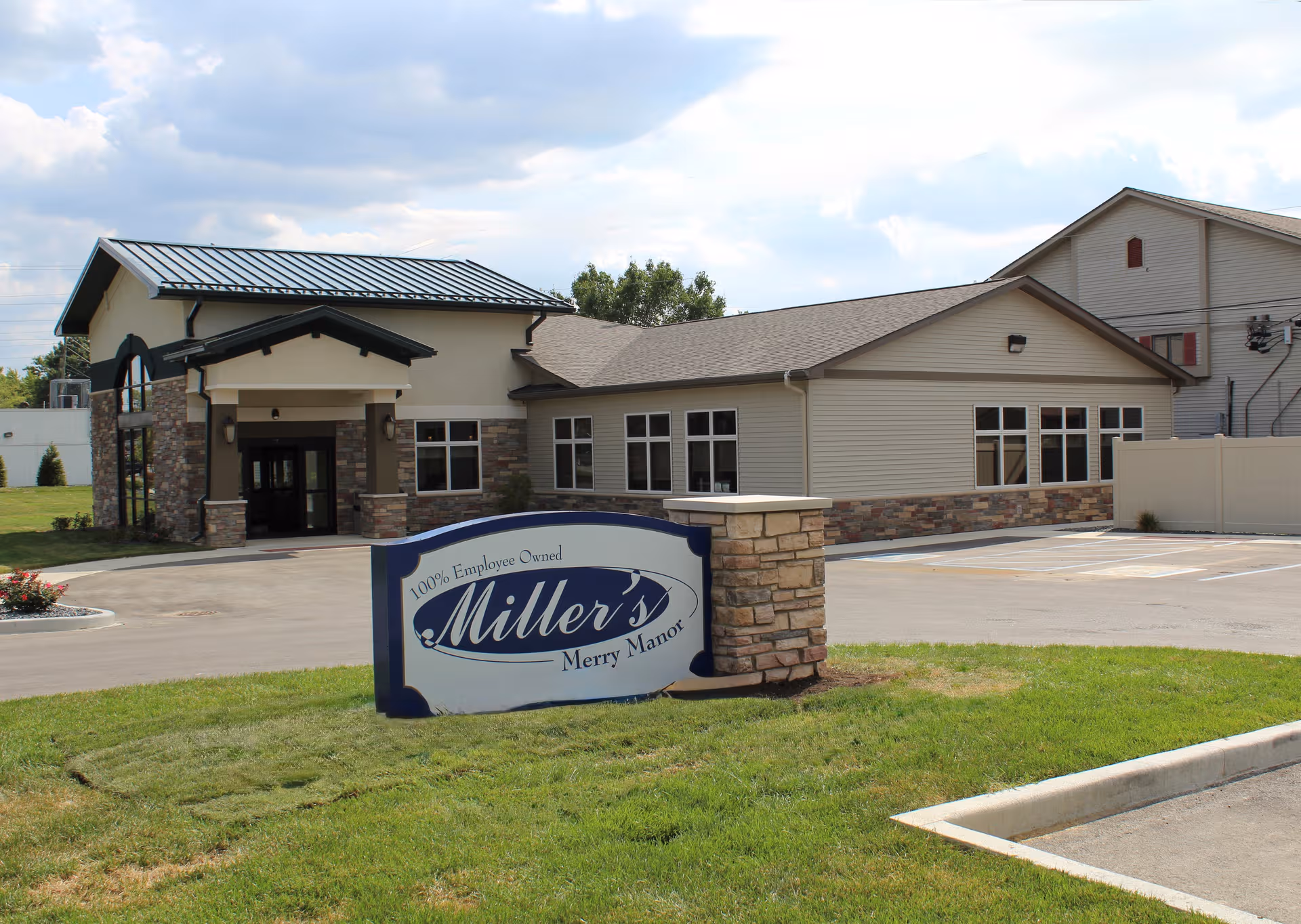 Exterior view of Miller's Merry Manor showing the entrance and front sign.