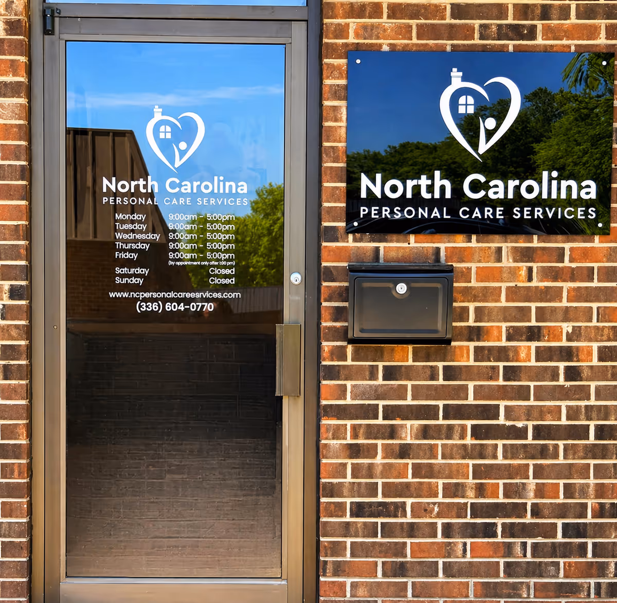 Brick exterior with glass door and a North Carolina Personal Care Services sign.
