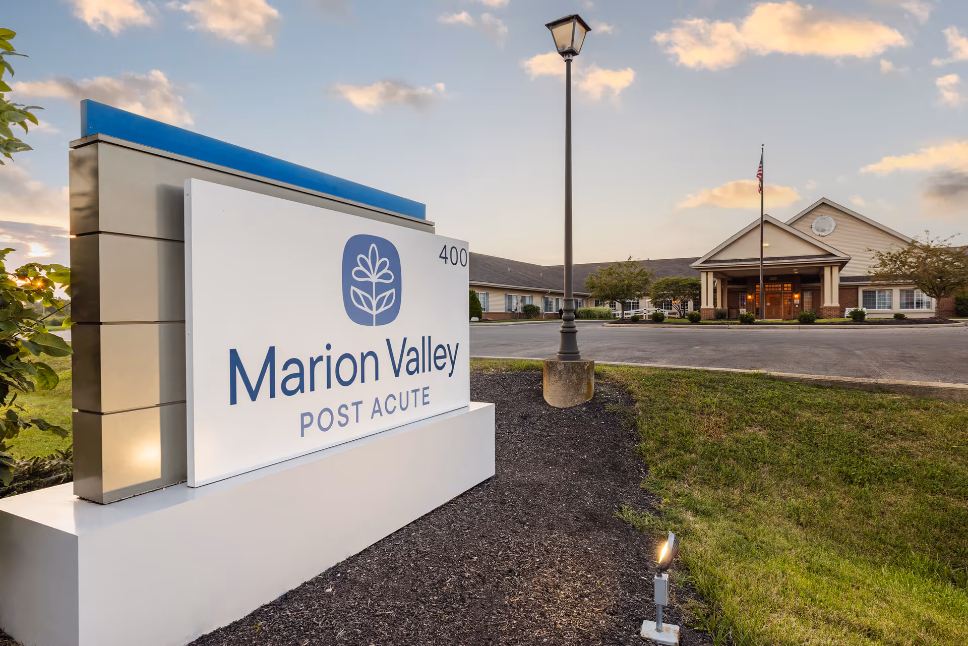 Exterior view of Marion Valley Post Acute facility with front sign and entrance