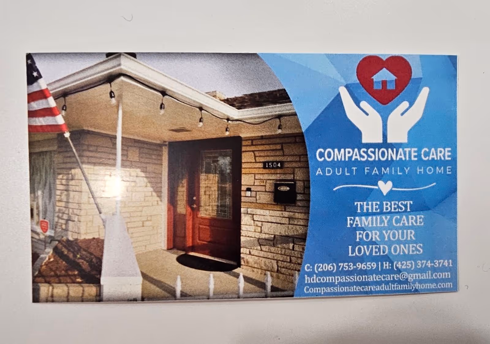 Front entrance of Compassionate Care Adult Family Home with blue banner.